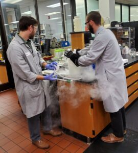 2 Engineers working in a lab with dry ice